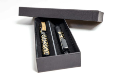 Gift set fountain pen and roller with golden ornament in a box